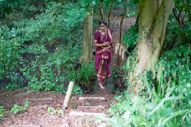 Chamu Kuppuswamy in maroon costume | Credit Simon Richardson