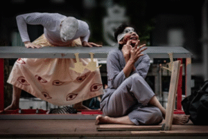 Read more about the article Clay, cues and cardboard houses: A day in the double life of a Performer-director