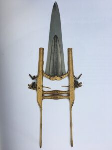 Punch Dagger With Pistols | Blade possibly Mughal Empire, late 17th century, hilt possibly Bundi, c. 1870-5 | Watered crucible steel, gold, rubies and emeralds